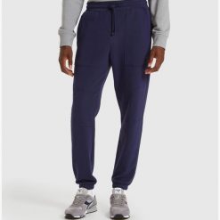 Spodnie dresowe męskie DIADORA PANTS CUFF SHIELD. Niebieskie spodnie dresowe męskie Diadora, bez wzorów, z dresówki. Za 89.99 zł.
