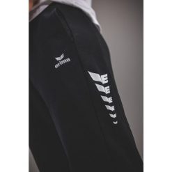 Spodnie dresowe Erima Cmpt Wings czarne. Czarne spodnie sportowe damskie 55PROTEC, s, z dresówki, na fitness i siłownię. Za 257.30 zł.