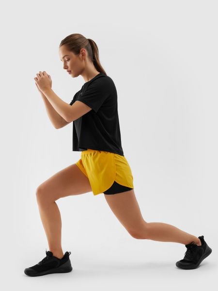 4F Spodenki treningowe 2w1 szybkoschnące damskie - pomarańczowe L. Brązowe spodenki sportowe damskie 4f, l, z dzianiny, na fitness i siłownię. W wyprzedaży za 59.99 zł.