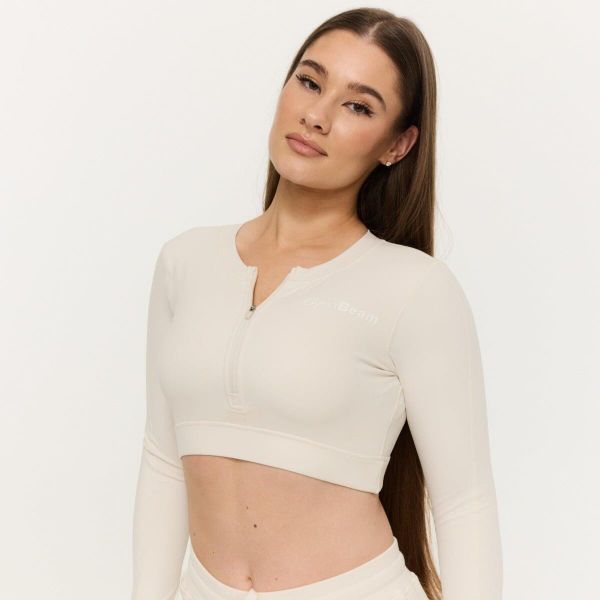 Top damski fitness z zamkiem Prime Pearl. Białe topy sportowe damskie GYMBEAM, s, bez wzorów, z elastanu, bez ramiączek. Za 109.90 zł.