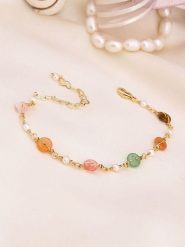 Pierres de Jade Pozłacana bransoletka z perłami i kocim okiem rozmiar: onesize. Białe bransoletki damskie Pierres de Jade, pozłacane. Za 43.99 zł.