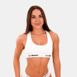 Biustonosz damski fitness z szerokimi ramiączkami biały Braletka. Białe biustonosze sportowe damskie GYMBEAM, bez wzorów, z bawełny. Za 55.90 zł.