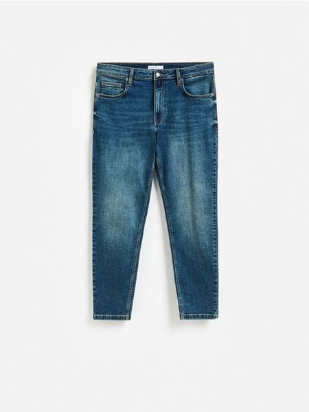 Jeansy carrot slim z efektem sprania - indigo jeans. Niebieskie jeansy męskie Reserved. Za 139.99 zł.
