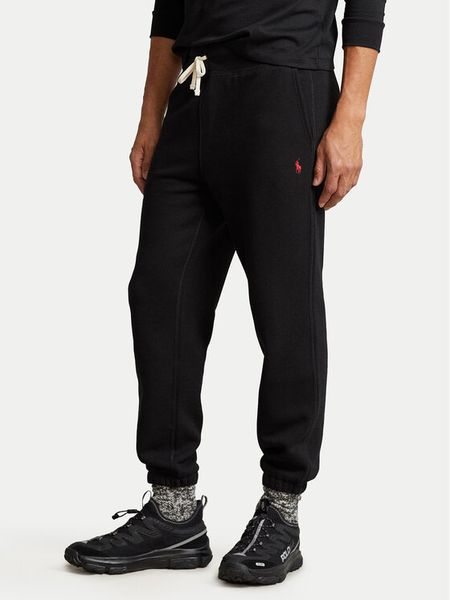 Polo Ralph Lauren Spodnie dresowe 710793939001 Czarny Relaxed Fit. Czarne spodnie dresowe męskie Polo Ralph Lauren, bez wzorów, z dresówki. Za 469.99 zł.