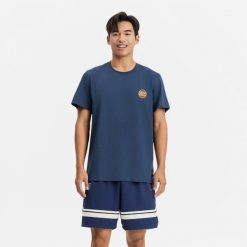 Koszulka koszykówki unisex Tarmak NBA Knicks TS 900. Niebieskie bluzki damskie TARMAK, s, bez wzorów, z bawełny, sportowe, bez kołnierzyka, bez ramiączek. Za 79.99 zł.