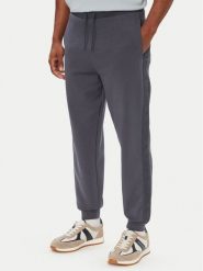 Guess Spodnie dresowe Z6YB13 K4965 Niebieski Regular Fit. Niebieskie spodnie dresowe męskie Guess, z aplikacjami, z bawełny. Za 394.99 zł.