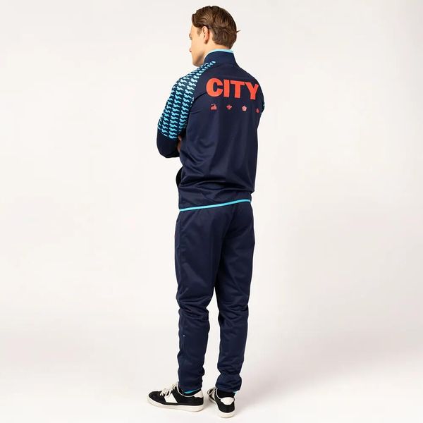 Dres piłkarski dla dorosłych Manchester City 24/25. Niebieskie spodnie dresowe damskie MANCHESTER CITY, xl, bez wzorów, z dresówki. W wyprzedaży za 214.99 zł.
