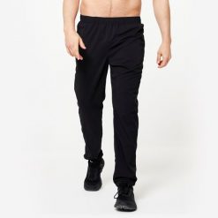 Spodnie fitness męskie Domyos Essential regular. Czarne spodnie sportowe męskie DOMYOS, z materiału. Za 69.99 zł.