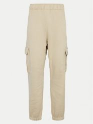 Champion Spodnie dresowe 117554 Beżowy Loose Fit. Brązowe spodnie dresowe damskie CHAMPION, xl, bez wzorów, z bawełny. Za 129.99 zł.