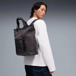 Plecak Puma Essentials Tote Backpack 12L. Czarne plecaki damskie Puma, bez wzorów, z materiału. Za 390.00 zł.