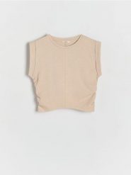 Bawełniany t-shirt - beżowy. Brązowe koszulki dziewczęce Reserved, bez wzorów, z bawełny, bez ramiączek. W wyprzedaży za 17.99 zł.