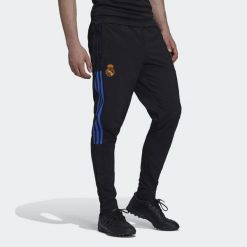 Spodnie joggingowe Real Madrid Tiro. Czarne spodnie materiałowe męskie Adidas, bez wzorów, z materiału, klasyczne, z standardowym stanem. Za 219.25 zł.