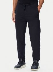 BOSS Spodnie dresowe Jt_Long Pants 50564096 Granatowy Relaxed Fit. Niebieskie spodnie dresowe męskie Boss, bez wzorów, z bawełny. Za 599.99 zł.