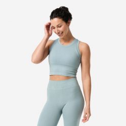 Koszulka do jogi i pilatesu damska 2w1 bez rękawów. Niebieskie bluzki sportowe damskie DOMYOS, xl, bez wzorów, z dzianiny, bez ramiączek. Za 89.99 zł.