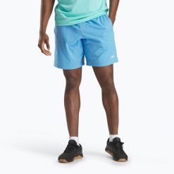 Spodenki Reebok Wor Woven. Niebieskie szorty sportowe męskie REEBOK FITNESS, na fitness i siłownię. Za 109.99 zł.