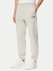 Calvin Klein Spodnie dresowe LV04LG212G Beżowy Regular Fit. Brązowe spodnie dresowe męskie CALVIN KLEIN, bez wzorów, z bawełny. Za 329.99 zł.