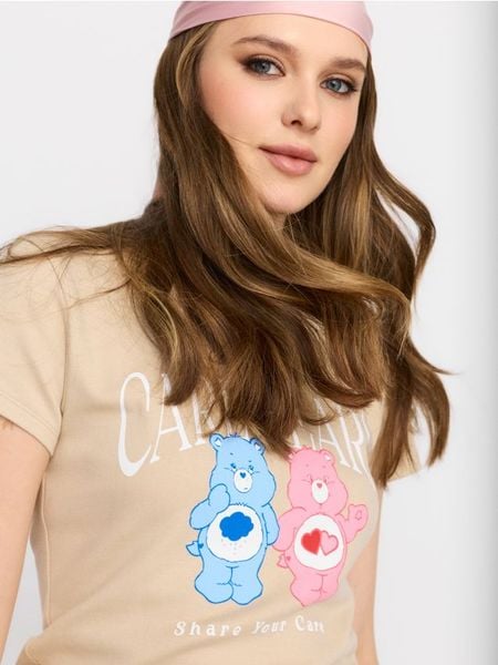 Bawełniana koszulka z krótkim rękawem Care Bears - beżowy. Brązowe t-shirty damskie Sinsay, l, bez wzorów, z bawełny, bez kołnierzyka. W wyprzedaży za 11.99 zł.