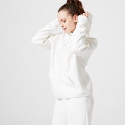 Bluza z kapturem damska Domyos Gym & Pilates 500. Białe bluzy sportowe damskie DOMYOS, l, z bawełny. W wyprzedaży za 89.99 zł.