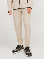Jack & Jones Spodnie dresowe w kolorze kremowym rozmiar: XL. Brązowe spodnie dresowe męskie Jack & Jones, bez wzorów, z dresówki. Za 110.04 zł.