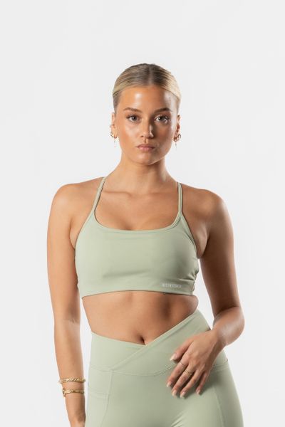 Damski stanik sportowy Luxe z odkrytymi plecami, wyjmowane wkładki – zielony. Zielone biustonosze sportowe damskie AESTHETIC WOLF, bez wzorów, z elastanu. Za 99.99 zł.