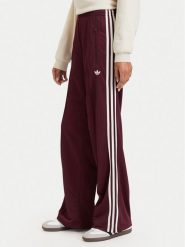 Adidas Spodnie dresowe Adicolor Classic Firebird KA7743 Brązowy Loose Fit. Brązowe spodnie dresowe damskie Adidas, l, bez wzorów, z dresówki. Za 299.99 zł.