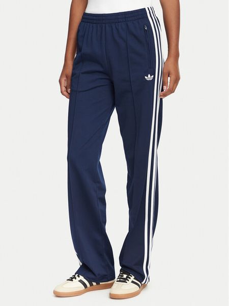 Adidas Spodnie dresowe Firebird Classic KS4795 Granatowy Regular Fit. Niebieskie spodnie dresowe damskie Adidas, s, bez wzorów, z dresówki. Za 255.99 zł.