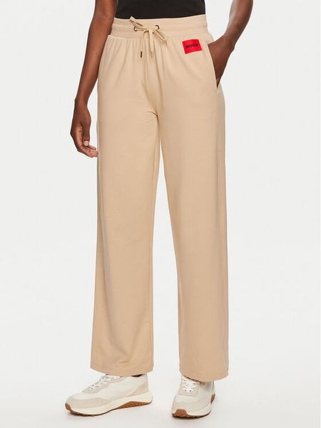 Hugo Spodnie dresowe Talua 50508694 Beżowy Relaxed Fit. Brązowe spodnie dresowe damskie Hugo, l, bez wzorów, z bawełny. Za 299.99 zł.