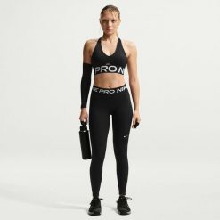 Spodnie fitness damskie Nike Pro. Czarne spodnie sportowe damskie Nike, m, z materiału, na fitness i siłownię. Za 248.00 zł.