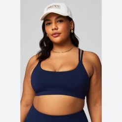 Biustonosz dla kobiet Fabletics Principal Low Impact. Czerwone biustonosze FABLETICS, bez wzorów, z materiału. Za 222.00 zł.