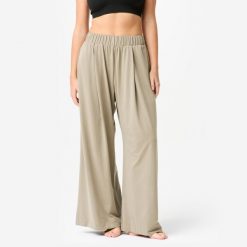 Spodnie do jogi i pilatesu damskie Domyos Retreat. Brązowe spodnie sportowe damskie Decathlon, l, z materiału, na fitness i siłownię. Za 129.99 zł.