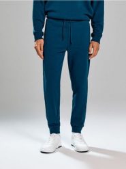 Spodnie regular fit - zielony. Zielone spodnie materiałowe męskie Sinsay, bez wzorów. Za 49.99 zł.