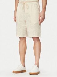 Guess Szorty sportowe F6GD03 kremKG362 Kremowy Regular Fit. Białe szorty męskie Guess, z aplikacjami, z bawełny, sportowe. Za 264.99 zł.