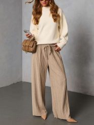 LA Angels Spodnie w kolorze beżowym rozmiar: XL. Brązowe spodnie materiałowe damskie LA Angels, bez wzorów, z materiału, z podwyższonym stanem. Za 195.99 zł.