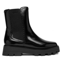 Sztyblety DKNY. Czarne botki damskie DKNY, bez obcasa, na płaskiej podeszwie, bez zapięcia. Za 789.99 zł.