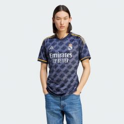 Koszulka Real Madrid 23/24 Away. Niebieskie t-shirty sportowe męskie Adidas, xs, z materiału, bez ramiączek, do piłki nożnej. W wyprzedaży za 329.20 zł.