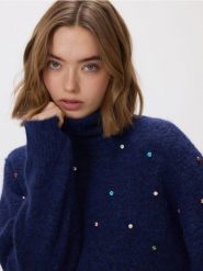 Sweter z błyszczącą aplikacją - granatowy. Niebieskie swetry klasyczne damskie Reserved, l, z dzianiny, bez kołnierzyka. Za 129.99 zł.