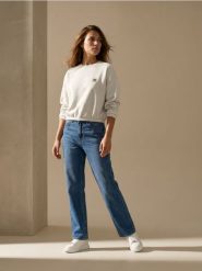 Spodnie jeansowe wide straight leg z efektem sprania - granatowy. Niebieskie spodnie materiałowe damskie Sinsay, bez wzorów, z jeansu, sportowe. Za 49.99 zł.