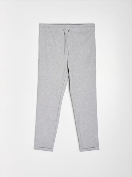 Spodnie jogger slim fit z domieszką wiskozy - szary. Szare spodnie materiałowe męskie Sinsay, bez wzorów, z wiskozy, sportowe. Za 49.99 zł.