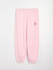 Spodnie jogger z kwiatowym nadrukiem - różowy. Czerwone spodnie materiałowe damskie Sinsay, bez wzorów. Za 39.99 zł.