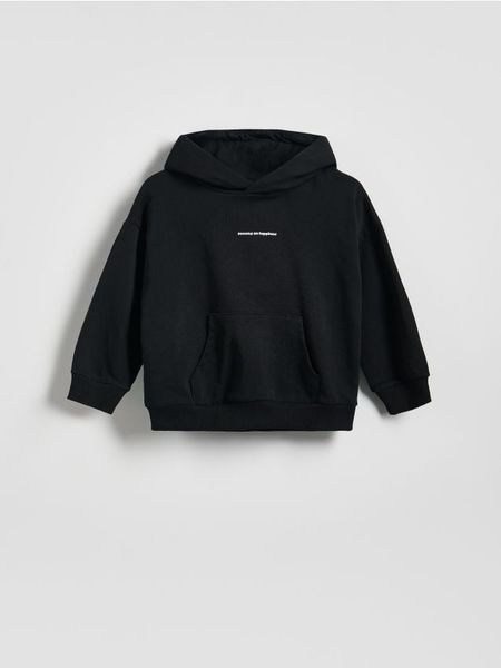 Bawełniana bluza z kapturem - czarny. Czarne bluzy i bluzki niemowlęce Reserved, bez wzorów, z bawełny, bez ramiączek, z kapturem. Za 45.99 zł.