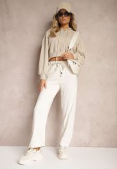 Jasnobeżowe Spodnie Dresowe Prążkowane o Szerokim Kroju High Waist Iriallia. Brązowe spodnie dresowe damskie Renee, m, bez wzorów, z dresówki. Za 44.99 zł.