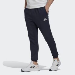 Spodnie dresowe męskie adidas Essentials Fleece Regular Tapered. Białe spodnie dresowe męskie Adidas, z dresówki. Za 142.00 zł.
