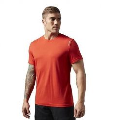 Koszulka sportowa damska Reebok EL Classic Tee. Czerwone bluzki sportowe damskie Reebok, bez wzorów, bez ramiączek. Za 113.00 zł.