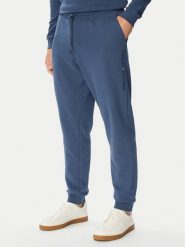 Tommy Hilfiger Spodnie dresowe UM0UM03664 Niebieski Regular Fit. Niebieskie spodnie dresowe męskie Tommy Hilfiger, bez wzorów, z dresówki. Za 289.99 zł.