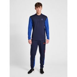 Jogging Hummel Pro Grid GK. Niebieskie szorty męskie HUMMEL, bez wzorów, sportowe. Za 246.95 zł.