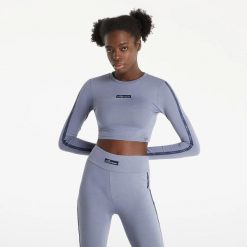 KOSZULKA DAMSKA Z DŁUGIM RĘKAWEM BLUZKA CROP ELLESSE. Czarne bluzki sportowe damskie Ellesse, s, z bawełny, bez kołnierzyka, bez ramiączek. Za 156.00 zł.