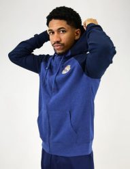 Granatowa bluza z kapturem Real Madryt. Białe bluzy sportowe damskie Real Madrid, m, bez wzorów, z bawełny, bez ramiączek, z kapturem. Za 299.19 zł.