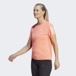 Koszulka do biegania damska Adidas Own the Run Tee. Brązowe bluzki damskie Adidas, xs, bez wzorów, z materiału, sportowe, bez kołnierzyka, bez ramiączek. W wyprzedaży za 115.45 zł.