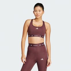 Biustonosz TECHFIT. Brązowe biustonosze sportowe damskie Adidas, bez wzorów, z elastanu. Za 175.45 zł.