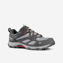 Buty turystyczne męskie Quechua MH100 wodoodporne. Czerwone buty trekkingowe męskie QUECHUA, z kauczuku, bez zapięcia, trekkingowe. Za 229.99 zł.